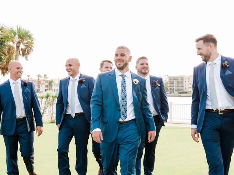 Groom and groomsmen walking to wedding ceremony