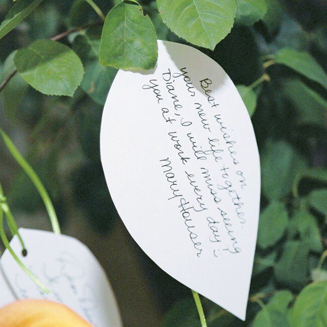 Diane used a leaf theme for the reception decor. Instead of a guest book, she cut out paper leaves and had guests write their best wishes and then pin the notes to a live tree in the entryway. Later, she created a handmade book filled with the leaf notes as a remembrance of the day.