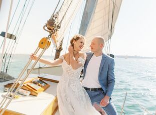 Elena and Art took to the sea for their vows. The couple tied the knot in front of an intimate group of friends while aboard a sailboat off the coast 