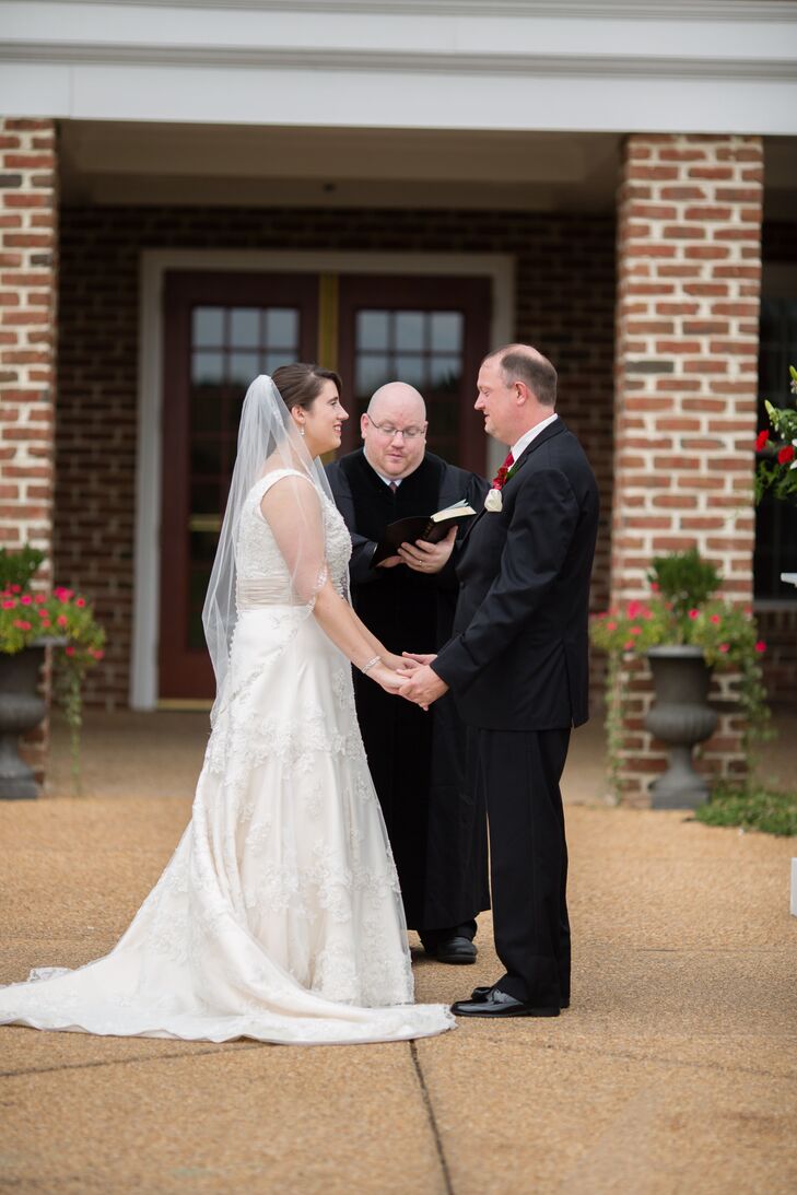 Couple Holding Hands During Ceremony