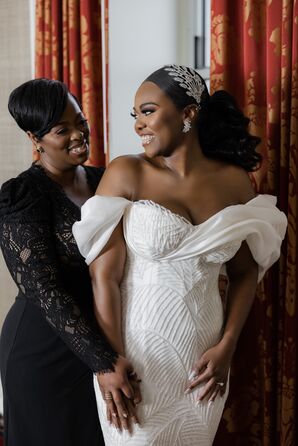Bride in Off-the-Shoulder Wedding Dress Smiling at Mother of the Bride