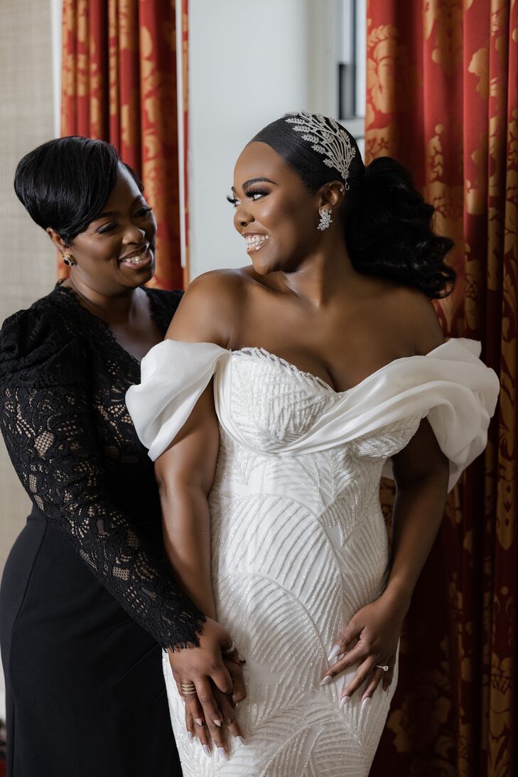Bride in Off-the-Shoulder Wedding Dress Smiling at Mother of the Bride