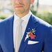 Groom in Blue Suit With Bougainvillea Boutonniere