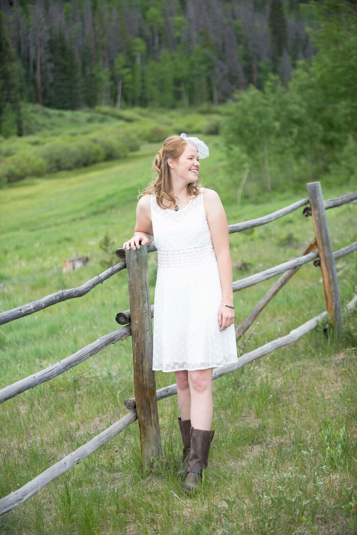 Julie wore a knee-length ivory lace dress from ModCloth with cowboy boots. She wore a simple birdcage veil. “My look focused on having a rustic and somewhat old-fashioned style,” Julie says.