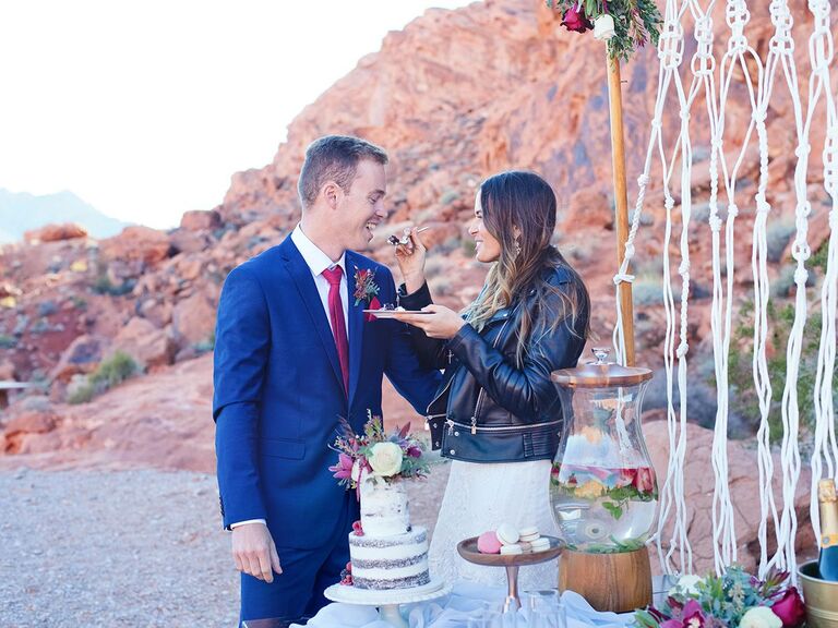 bride and groom cutting cake 