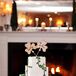 Four-Tier White Wedding Cake with Shamrock Decor
