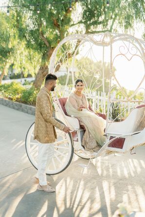 Groom Helping Bride Step Out of a Carriage Before Their Pakistani-American Wedding