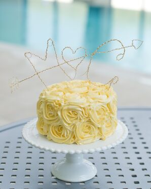 Yellow Rosette-Covered Wedding Cake