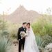 Couple Posing for Portraits in Desert in Scottsdale, Arizona
