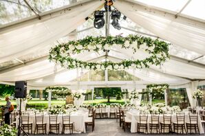 The Wedding Reception Tent decked out in white roses, ferns and eucalyptus