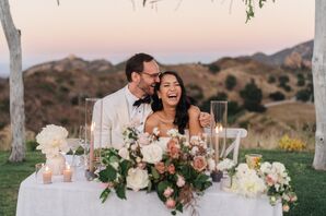 Couple at Sweetheart Table Laughing
