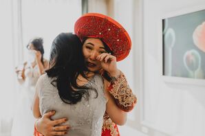 Bride in Vietnamese Ao Dai Crying and Hugging Family Member