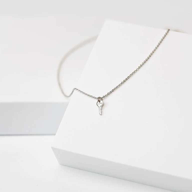 Silver key necklace from The Giving Keys for the best 25th wedding anniversary gift