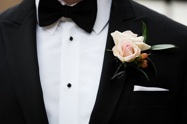Alan and his groomsmen wore blush rose blooms accented with red hypericum berries for their boutonnieres. They loved the classic look and how they matched the other classic floral arrangements.