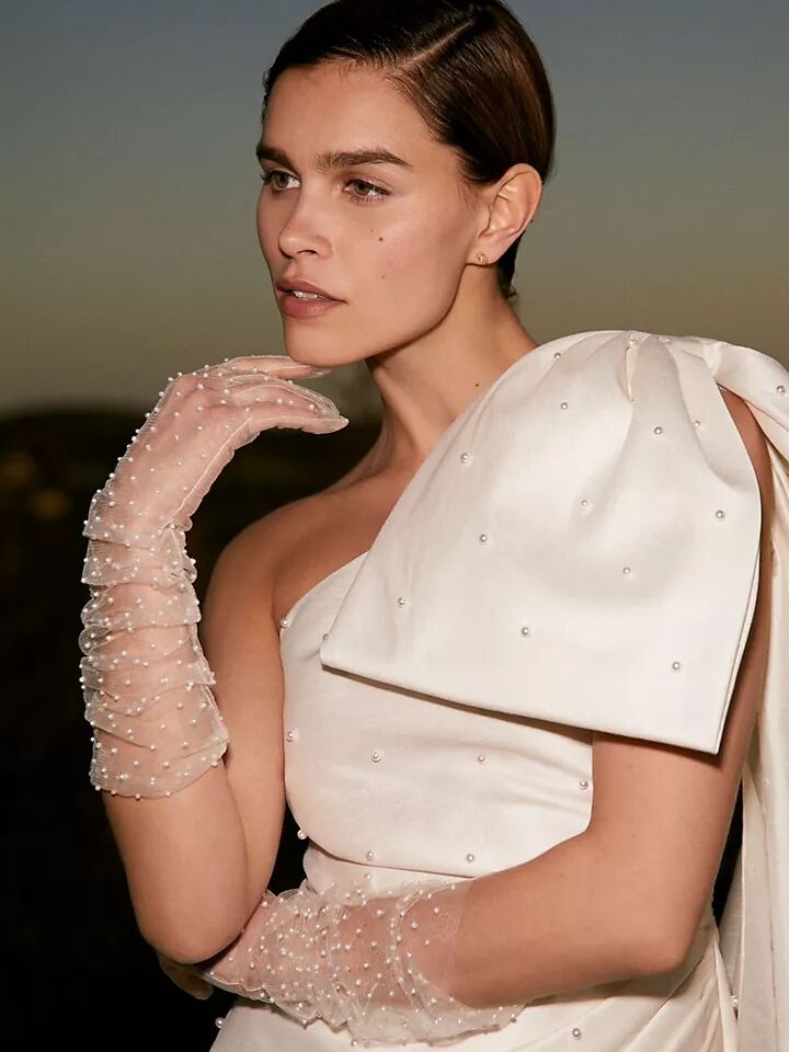 Sheer mid-length white sleeves dotted with small pearls from Anthropologie