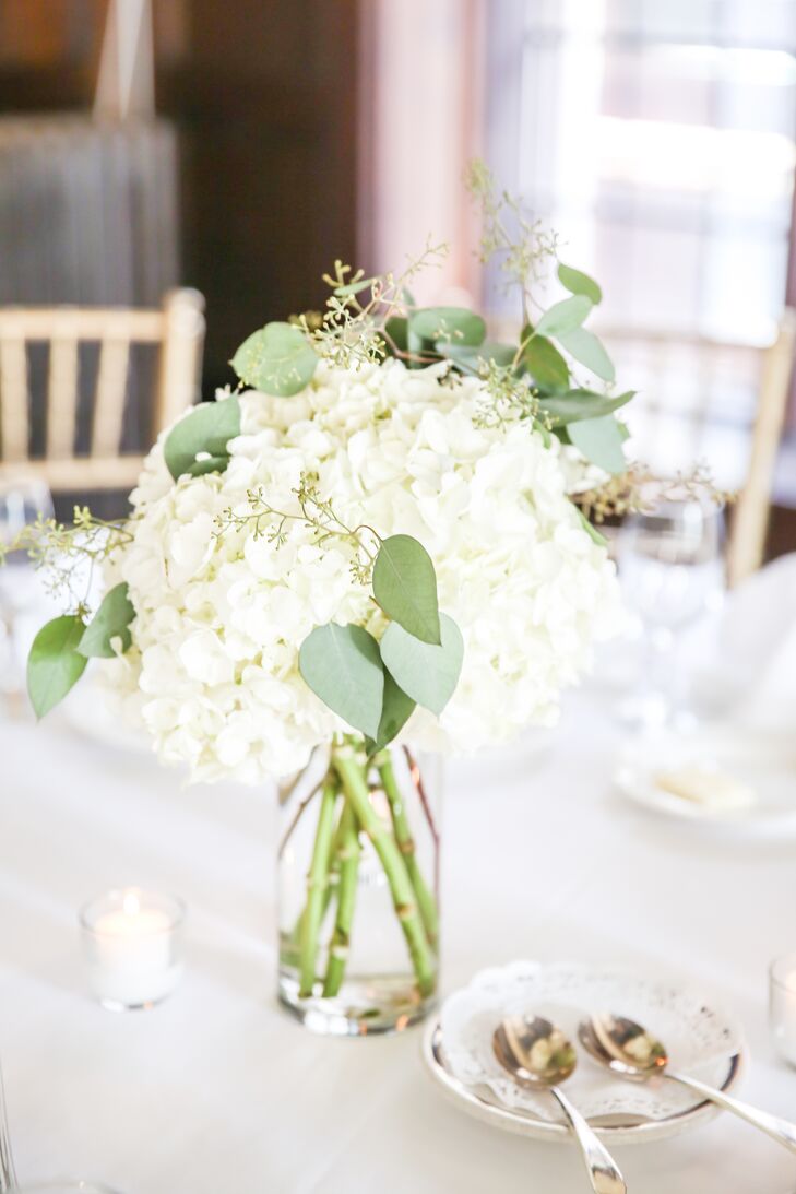 Each round reception table was topped with elegant, ivory and green centerpieces made from hydrangeas, eucalyptus leaves and seeded eucalyptus.