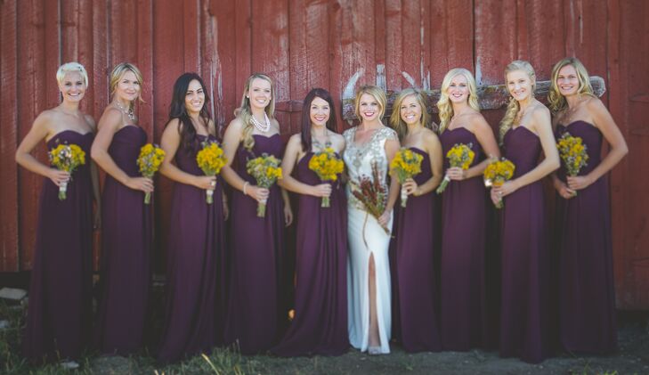The bridesmaids wore matching strapless, floor-length deep burgundy dresses for the fall wedding in Meeker, Colorado. Since Kelsey and Joey love the fall, they let the natural shades of yellow, brown and purple color their wedding.