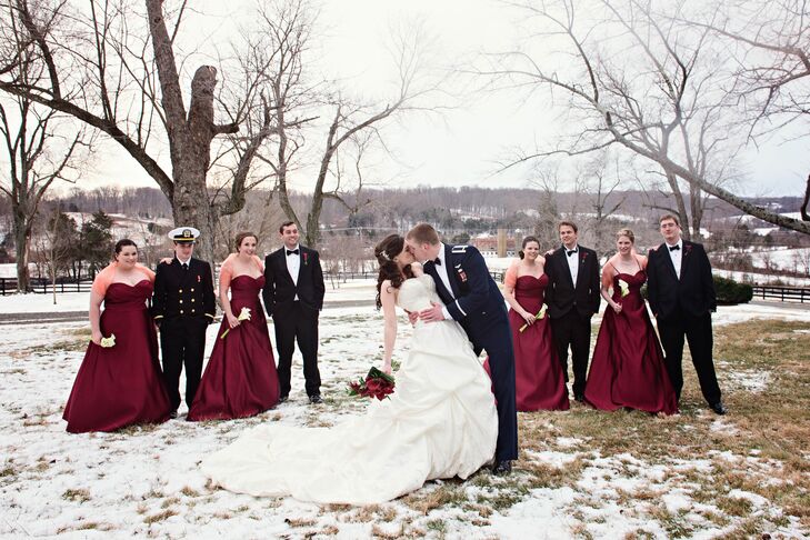 The bridesmaids wore strapless, floor length red dresses from Bill Levkoff, which they wore with stoles for the winter weather.