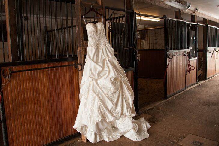 Karen wore a ball gown from Kenneth Winston's Private Label by G collection. The wedding dress was strapless with beading in the bodice and a bustle skirt.