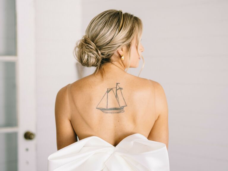 Bride wears her hair in a messy low bun. 