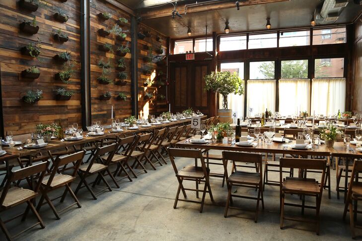 While guests enjoyed cocktail hour in the Brooklyn Winery’s main bar, the Atrium was transitioned for the reception. Long wooden farm tables joined the ranks of rustic touches, like the succulent garden wall, bringing character and personality to the light-filled space. Centerpieces filled with coral and pink flowers added a playful pop of color to the room, while details like brass candlesticks and vintage floral china introduced an element of  old world charm to the decor.