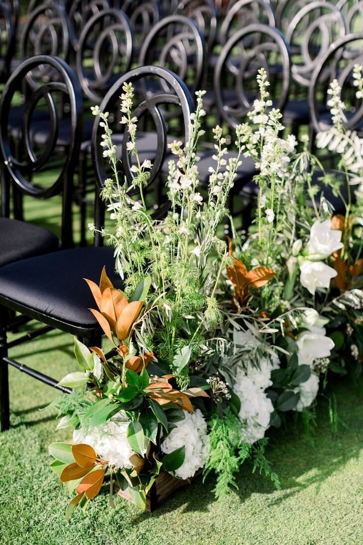 Art Deco Chairs and Gardenia and Magnolia Leaf Aisle Arrangements