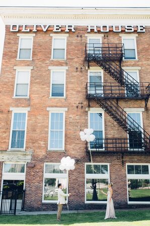 Couple Releasing Balloons, Historic Brick Venue