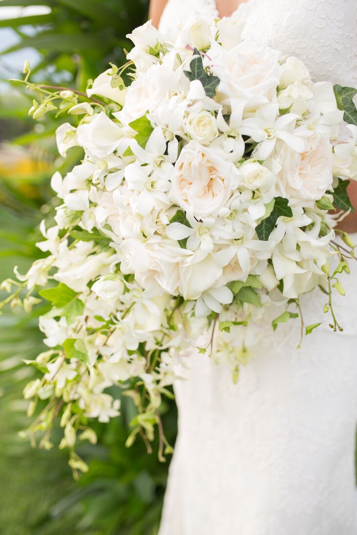 Bethany's bouquet was a cascading collection of white and ivory roses, dendrobium orchids and calla lilies.