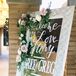 "We wanted lots of mirrors with calligraphy to decorate the ceremony, as well as the reception," says Bree. Several elegantly framed mirrors were decorated with blush roses and greenery.