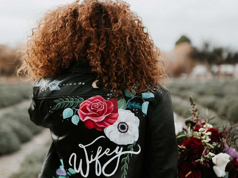 Bride wearing leather wedding jacket