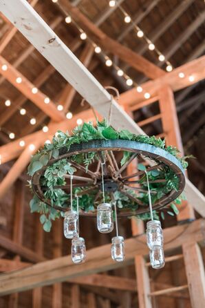 Rustic Wheel Chandelier with Hanging Mason Jars and Greenery