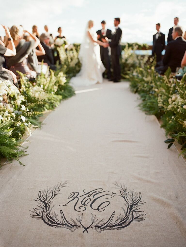 Linen aisle runner featuring a custom monogram. 
