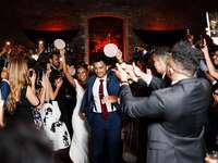 wedding couple dancing with tambourines