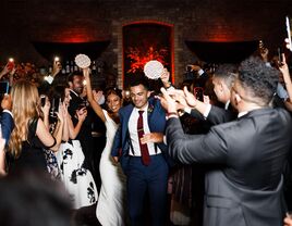 wedding couple dancing with tambourines