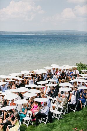 Guests Under Umbrellas at Lakefront Northern Michigan Wedding