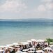 Guests Under Umbrellas at Lakefront Northern Michigan Wedding