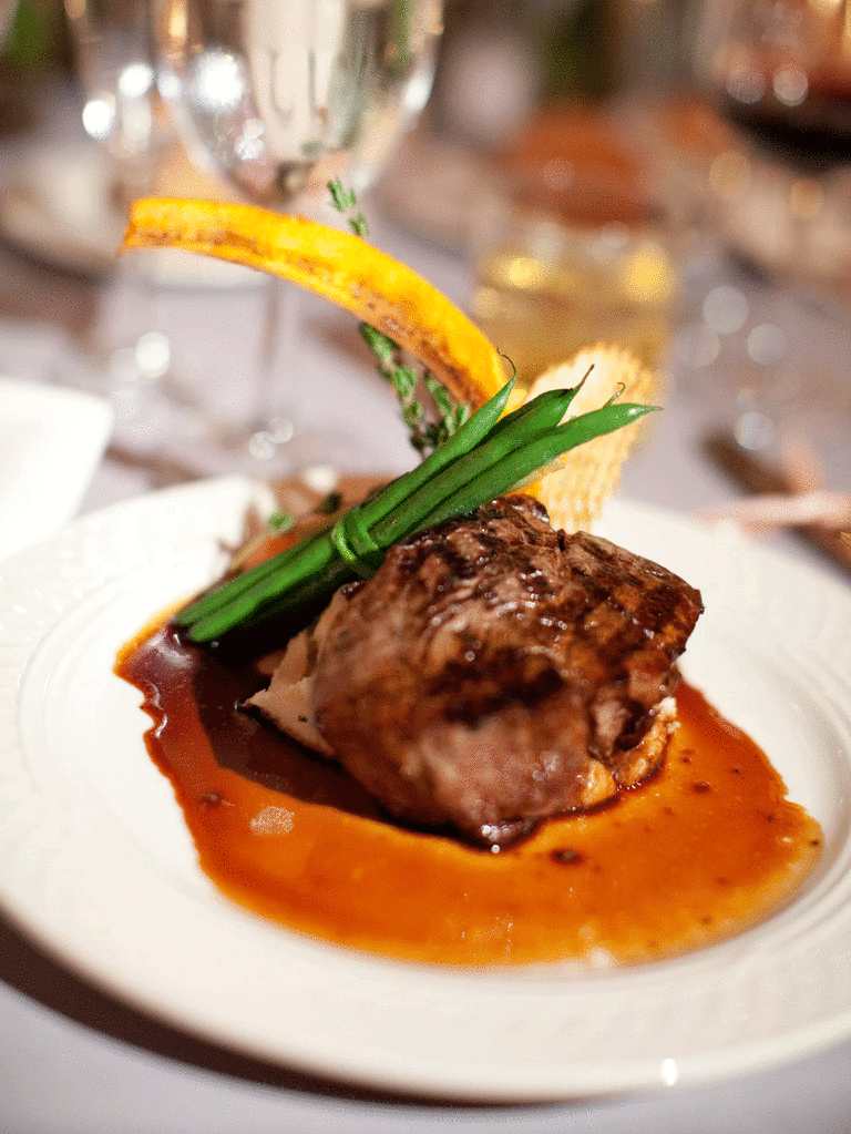 Filet mignon served with winter vegetables.
