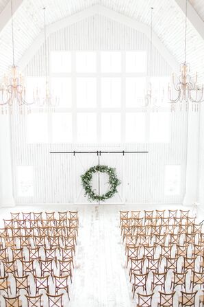 Whitewashed Barn Ceremony with Cross-Back Chairs and Oversize Wreath Backdrop