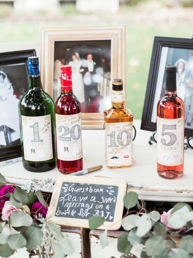 alternative wedding guest book idea anniversary wine bottles with custom labels