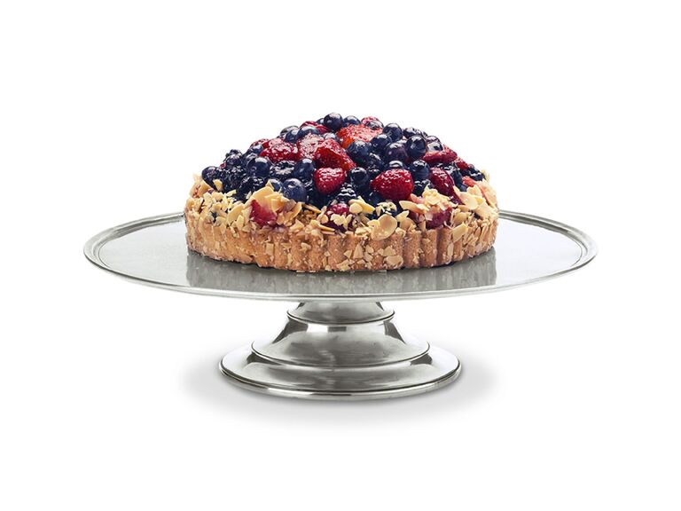 Short pewter wedding cake stand pictured with dessert flan