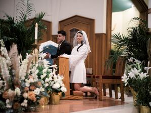 Couple Kneeling During Catholic Wedding Mass