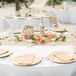 “For our centerpieces, we wanted something unique and natural that played off our surroundings,” says Whitney. Together, she and Ryan crafted decorated sand-blasted manzanita branches with silk flowers in shades of vibrant color to use as the focal point of the centerpieces. They then added starfish, seashells, wicker lanterns and gold votives to really play up the display’s beachy vibe. “My mom also antiqued blue bottles, which turned out to be amazing!” says Whitney.rn