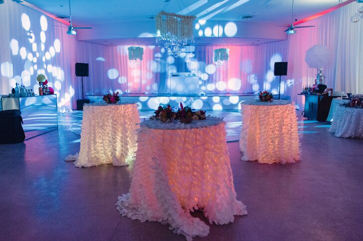 High-top tables, which were uplit and dressed with petal linens, surrounded the dance floor.