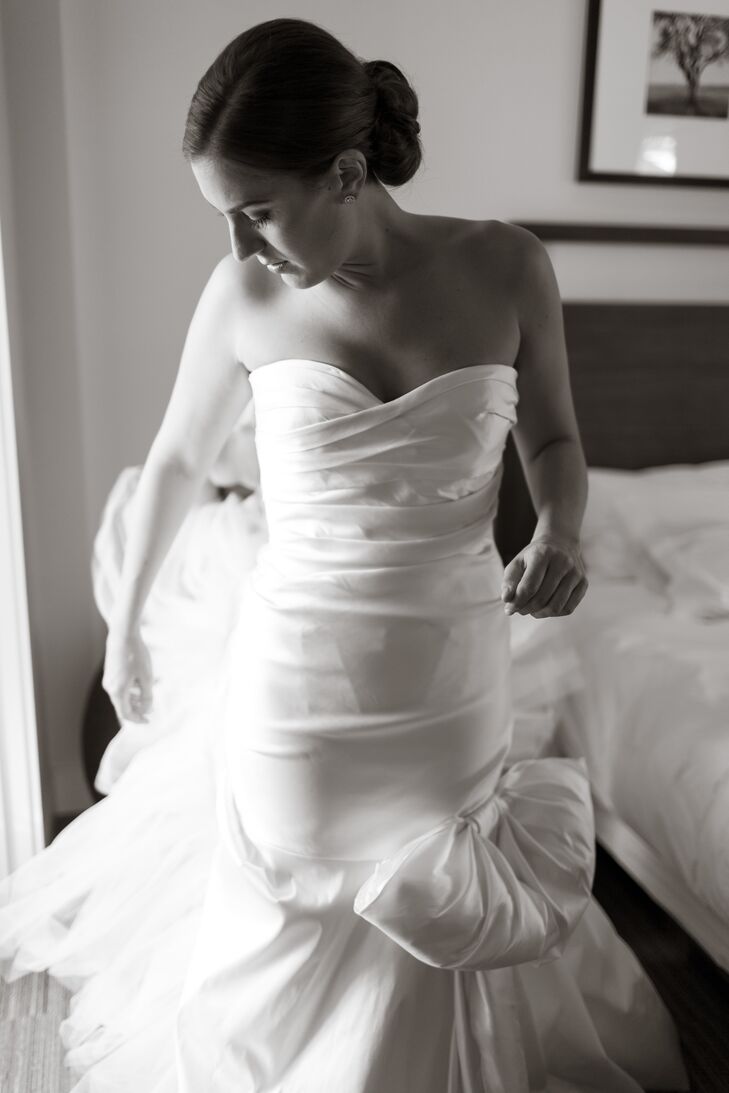 Kendal had planned on finding a simple, strapless, fitted lace gown. At her first dress appointment at Marina Morrison in San Francisco, her consultant insisted she try on this Italian silk dress by Oscar de La Renta. Her dress matched the wedding style with simple beautiful silk, a sweetheart strapless neckline and mermaid fit tied with a large bow on the left side.