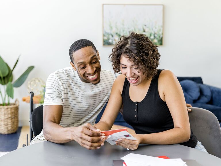 Couple opening gift card wedding registry present trending for 2023