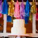 Buttercream Wedding Cake and Colorful Pom-Poms