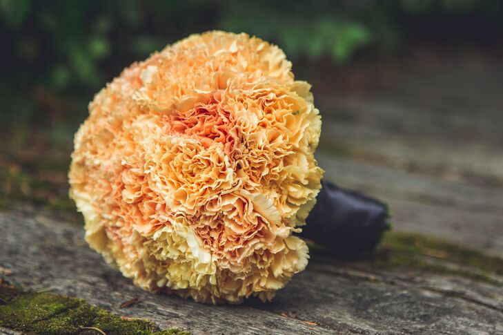 Each bridesmaid carried an orange color or orange inspired bouquet of different flowers.