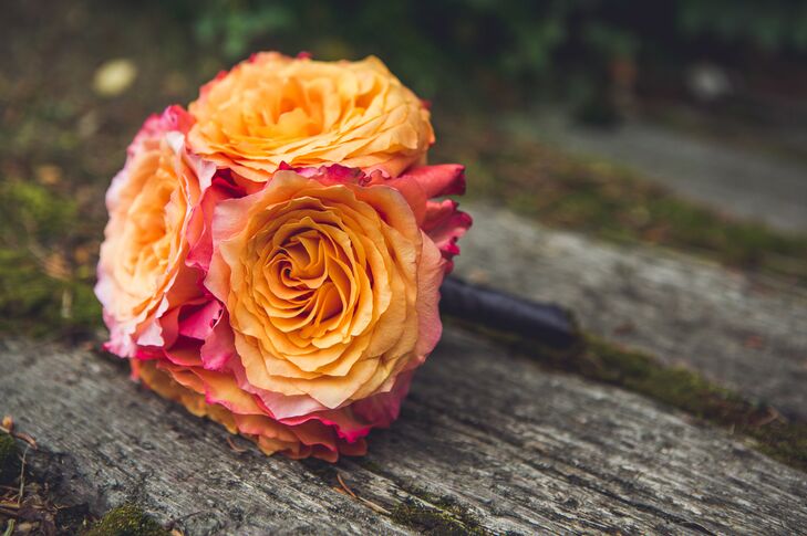 Each bridesmaid carried an orange color or orange inspired bouquet of different flowers.