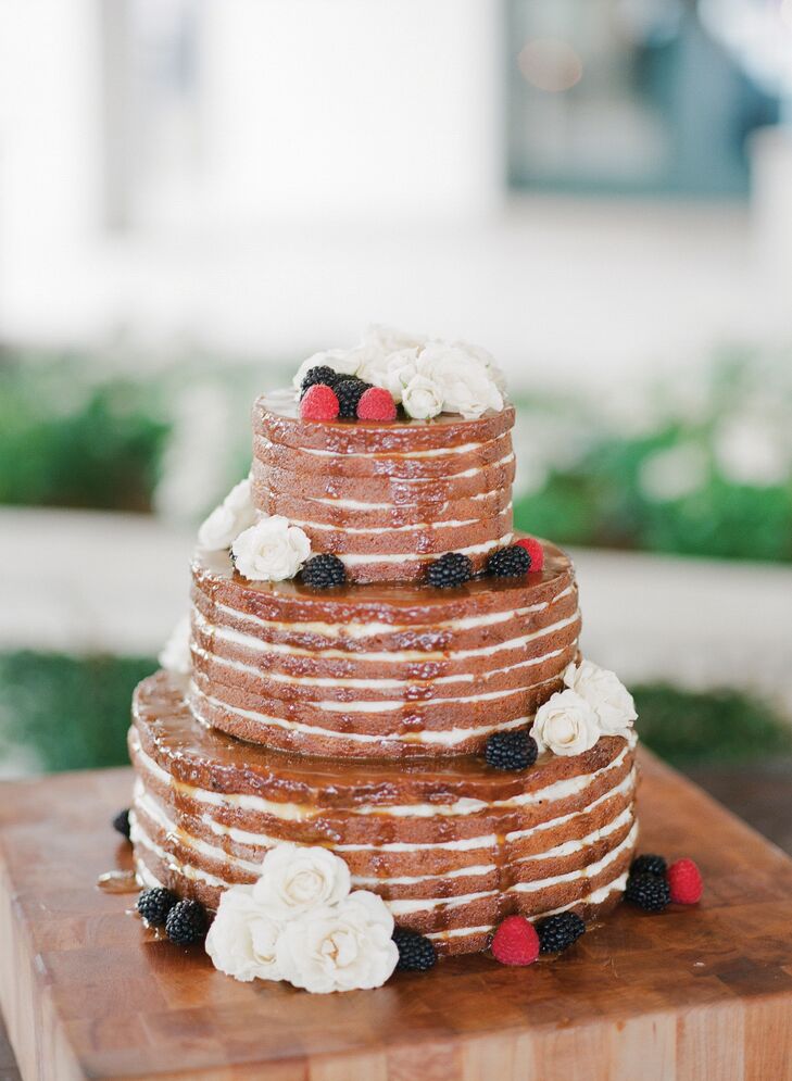 Dessert is Trey’s favorite part of every meal, and it was important to him that the cake looked as good as it tasted! A naked cake was the way to go for their rustic, natural wedding: It was a three-tiered carrot cake with vanilla cream cheese frosting and drizzled caramel sauce with fresh flowers and berries on top. Also, their cake was totally gluten-free!
