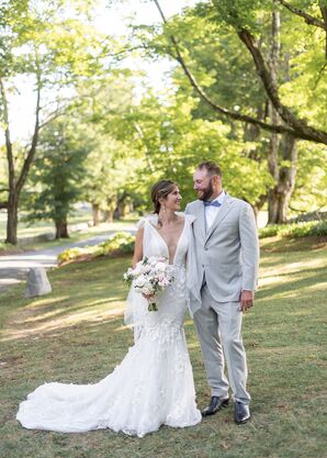 Bride in Wedding Dress With Plunging Neckline and Groom in Light Gray Suit at Country Wedding